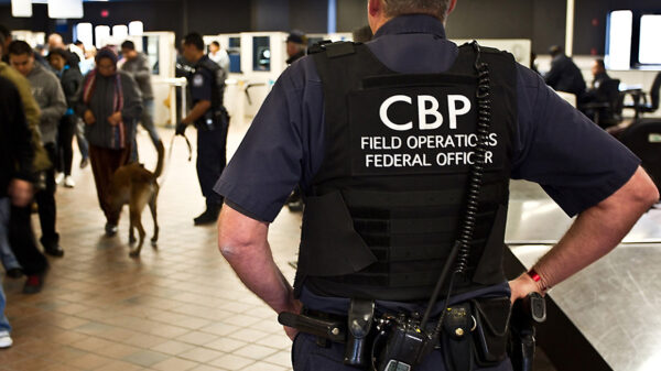CBP officer watching pedestrian entrance