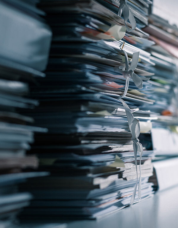 Stacks of files in a dark office