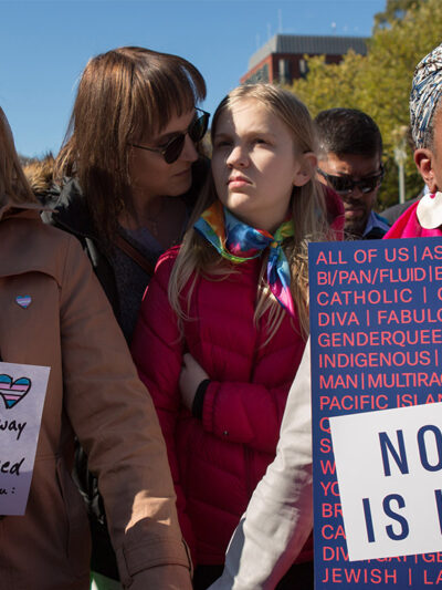 Protesters marching in favor of the rights of trans people