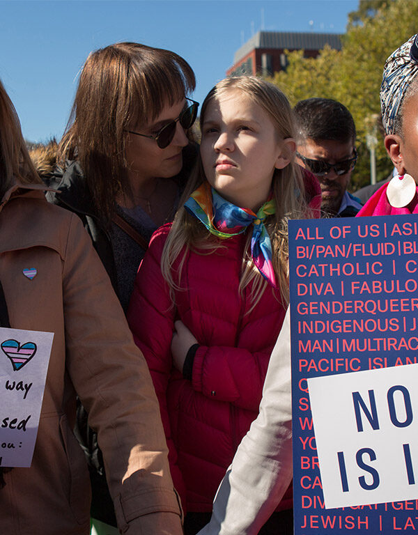 Protesters marching in favor of the rights of trans people