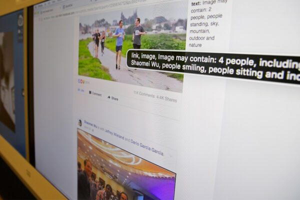 A screen displaying Facebook's facial recognition technology