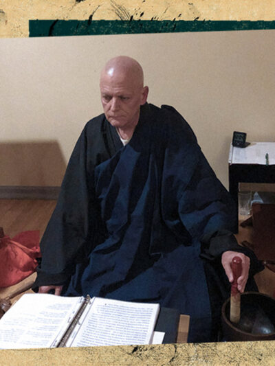 Reverend Seigen Hartkemeyer Zen Buddhist Priest with book