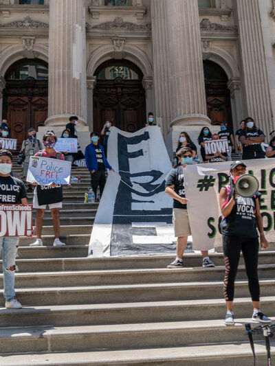 Protesters demanding removing police officers from schools on steps of Department of Education in Manhattan, New York.