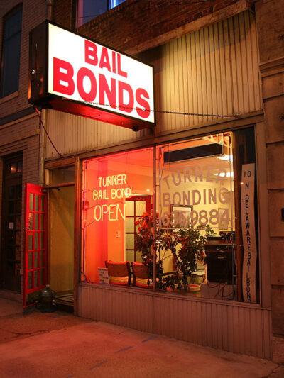 Photo of a bail bonds shop at night.