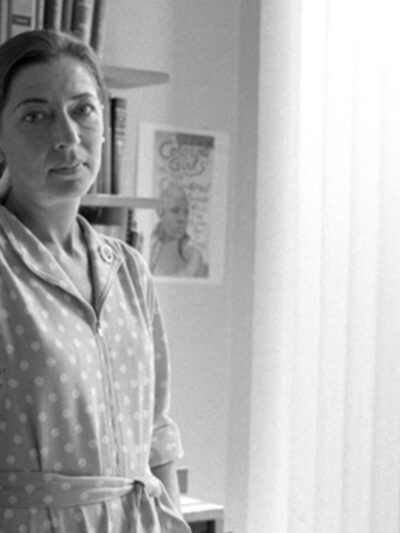 Ruth Bader Ginsberg standing in an office, 1977