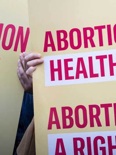 Protest signs advocating for abortion access.