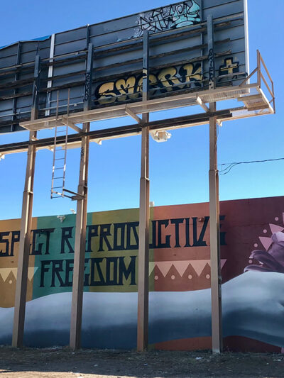 A mural with the text "Respect Reproductive Freedom."