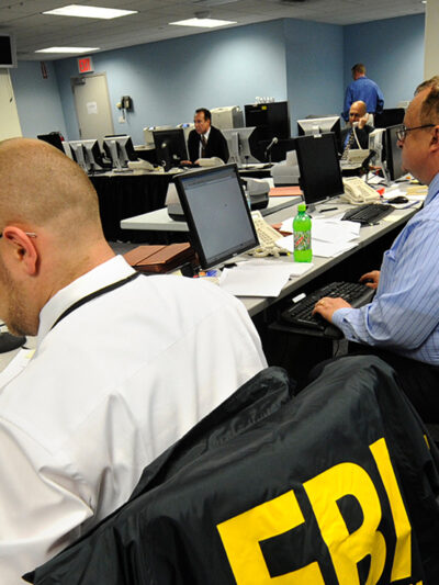 An FBI agent reads through documents.