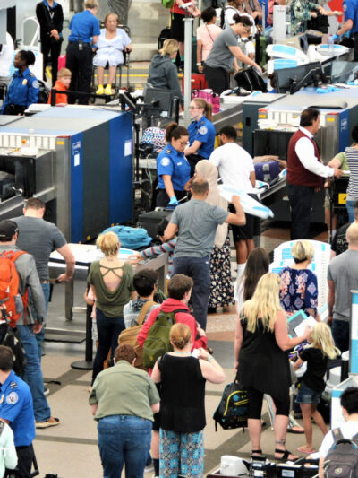 Travelers waiting in long lines to pass through the Transportation Security Administrations (TSA) security screening areas to get to their flights.