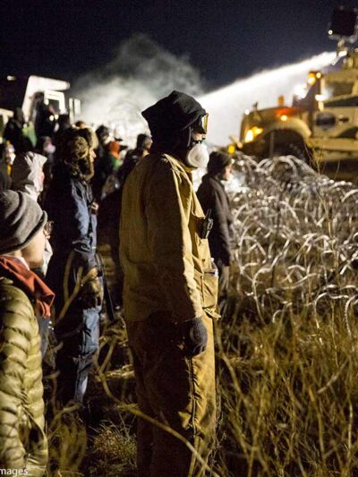 Police use a water cannon to drench opponents of the Dakota Access oil pipeline during a standoff in freezing temperatures on Backwater Bridge near the pipeline route on November 20, 2016. Cannon Ball, North Dakota