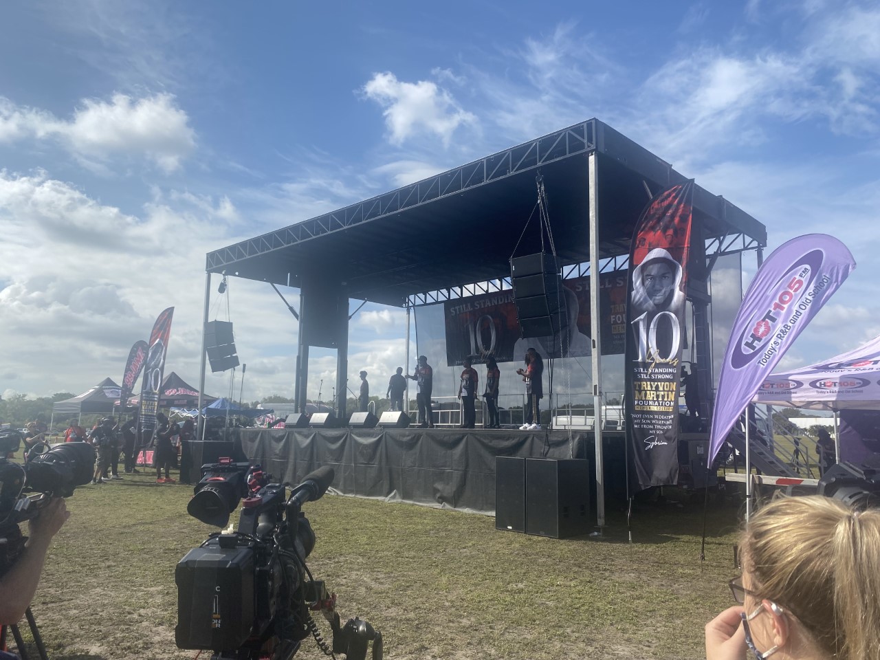 Actor Jamie Foxx, wearing white shoes, stands on stage with the family of Trayvon Martin at an event Feb. 5, 2022 in Miami on what would have been Trayvon's 27th birthday, commemorating a decade since his death. (ACLU of Florida)