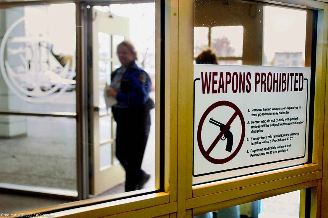 A sign at the entrance of the city hall in Anchorage, Alaska, that warns handgun owners that guns are prohibited in the building.