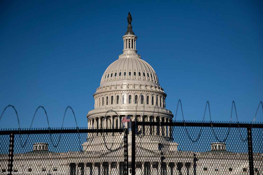 Black fence in front of Capitol building in Washington, DC.