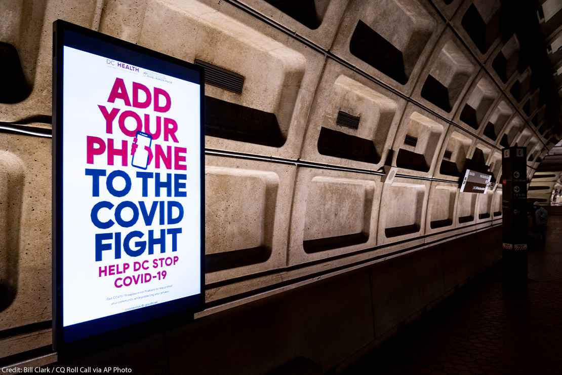 An electronic ad inside DC's Metro Station for the the DC Department of Health's mobile Covid-19 contact tracing app.