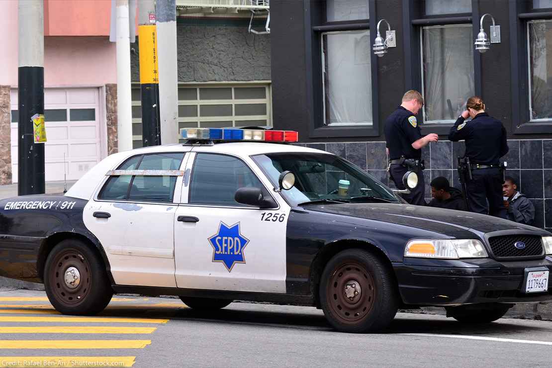 White SFPD officers interrogating Black men in San Francisco.