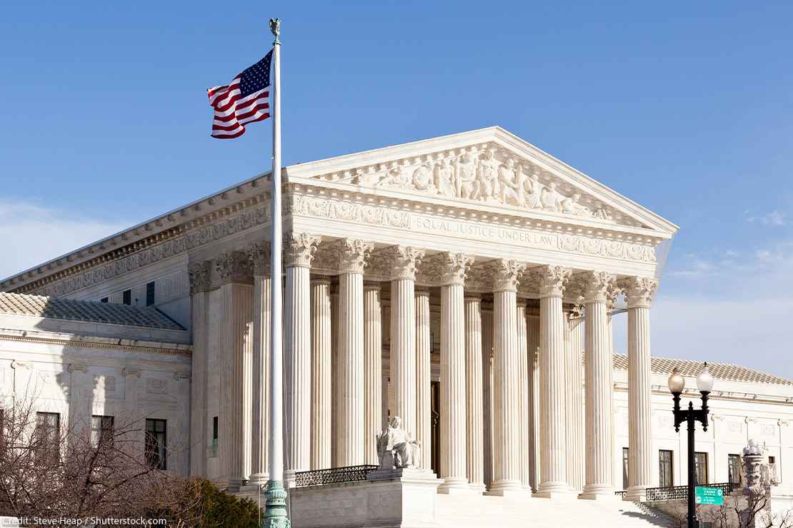 The front of the Supreme Court building in Washington DC on a sunny day.