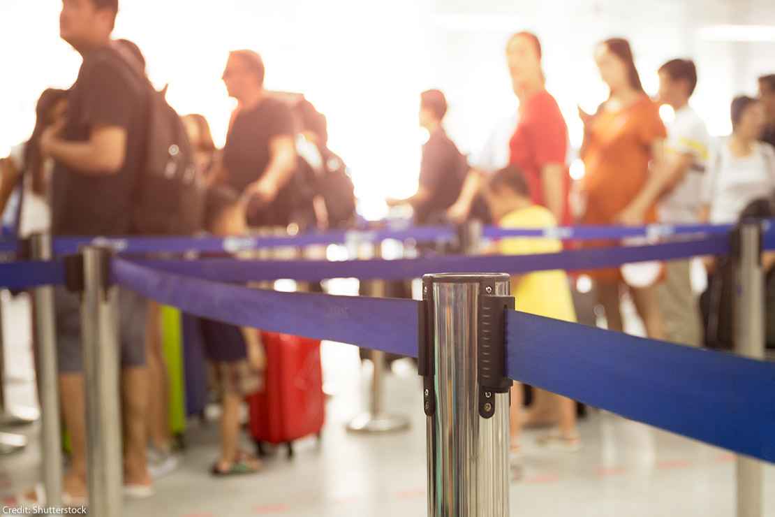 People waiting in line at an airport.