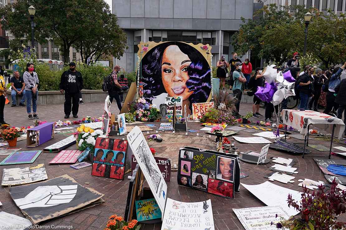 People gather in Jefferson Square in Louisville, awaiting word on charges against police officers in the death of Breonna Taylor.