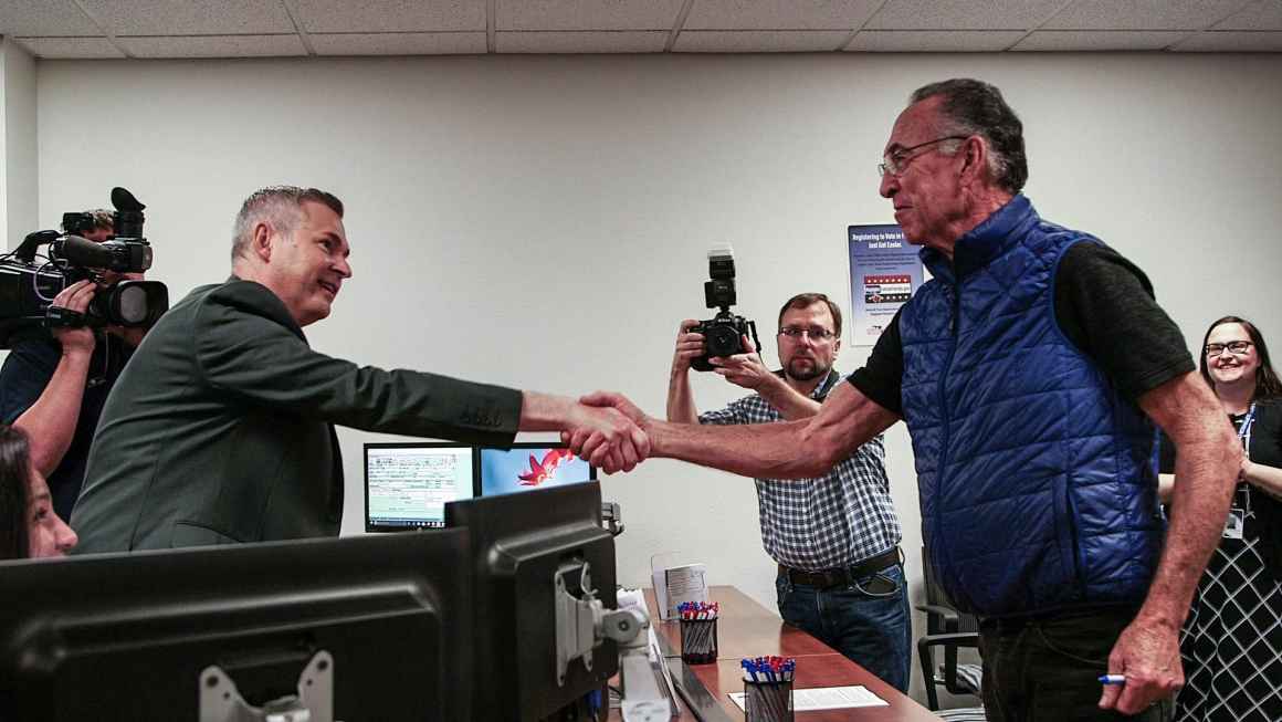 Sarasota Supervisor of Elections Ron Turner with Vietnam War veteran and Purple Heart recipient Alan Rhyelle