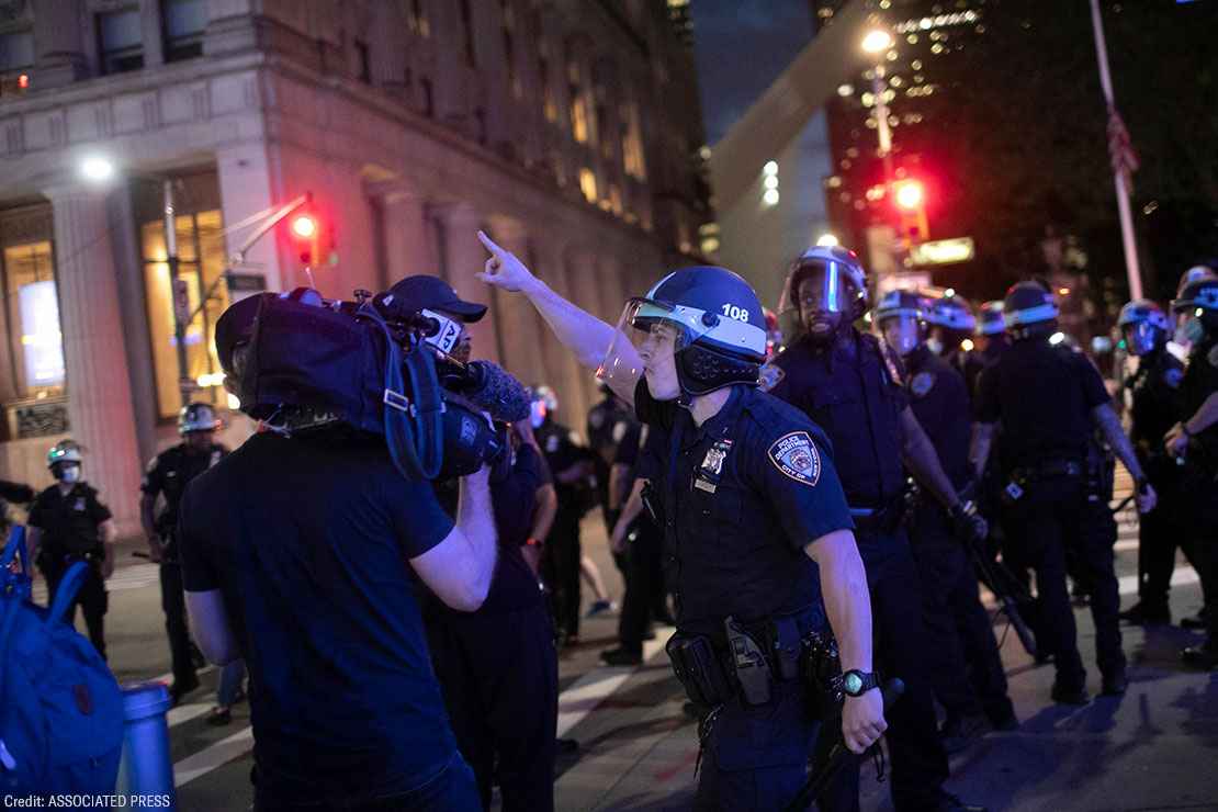 A police officer shouts at Associated Press videojournalist Robert Bumsted, Tuesday, June 2, 2020, in New York.