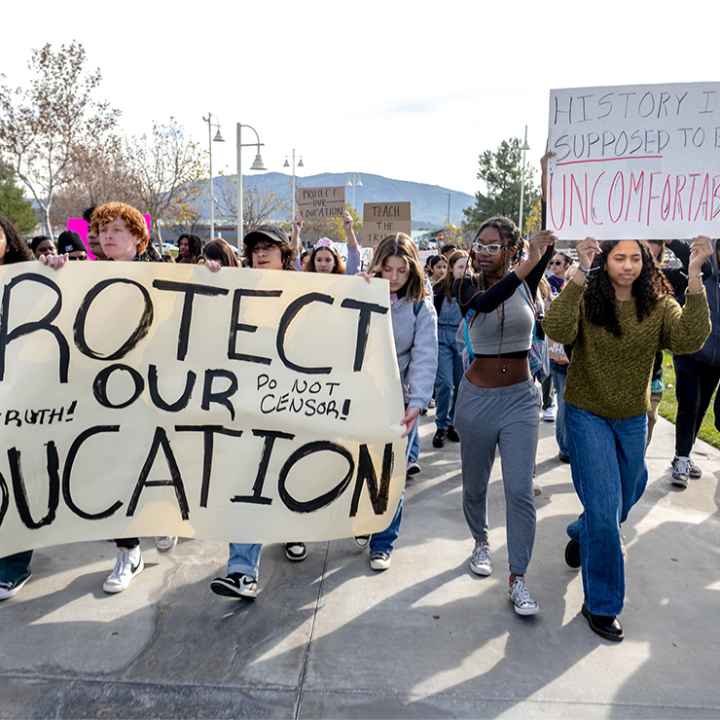 High school students march in protest of the district's ban of critical race theory curriculum at Patricia H. Birdsall Sports Park in Temecula, Calif., on Friday, Dec. 16, 2022.